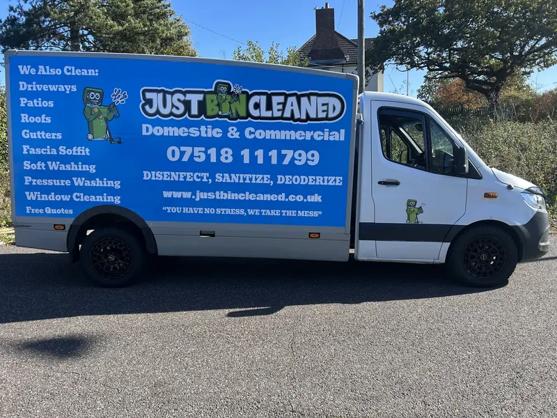 JustBinCleaned van with its blue livery listing driveways, patios, roofs, gutters and window cleaning