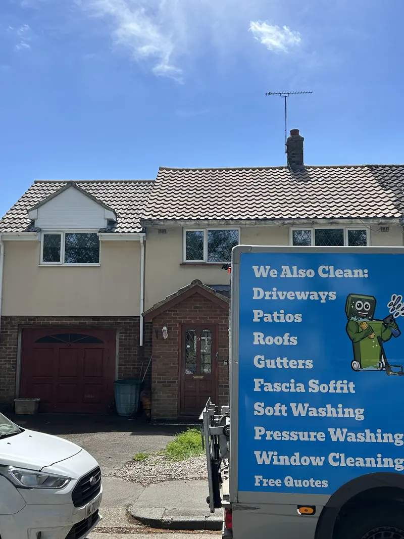 JustBinCleaned van outside a semi-detached house, side panel listing services
