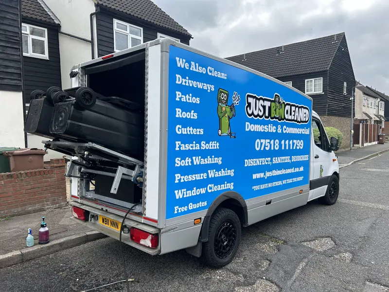 JustBinCleaned van with its bin washing rig at the back, parked on a residential street