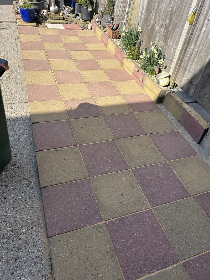 Yellow and red chequered patio after cleaning, bright and even