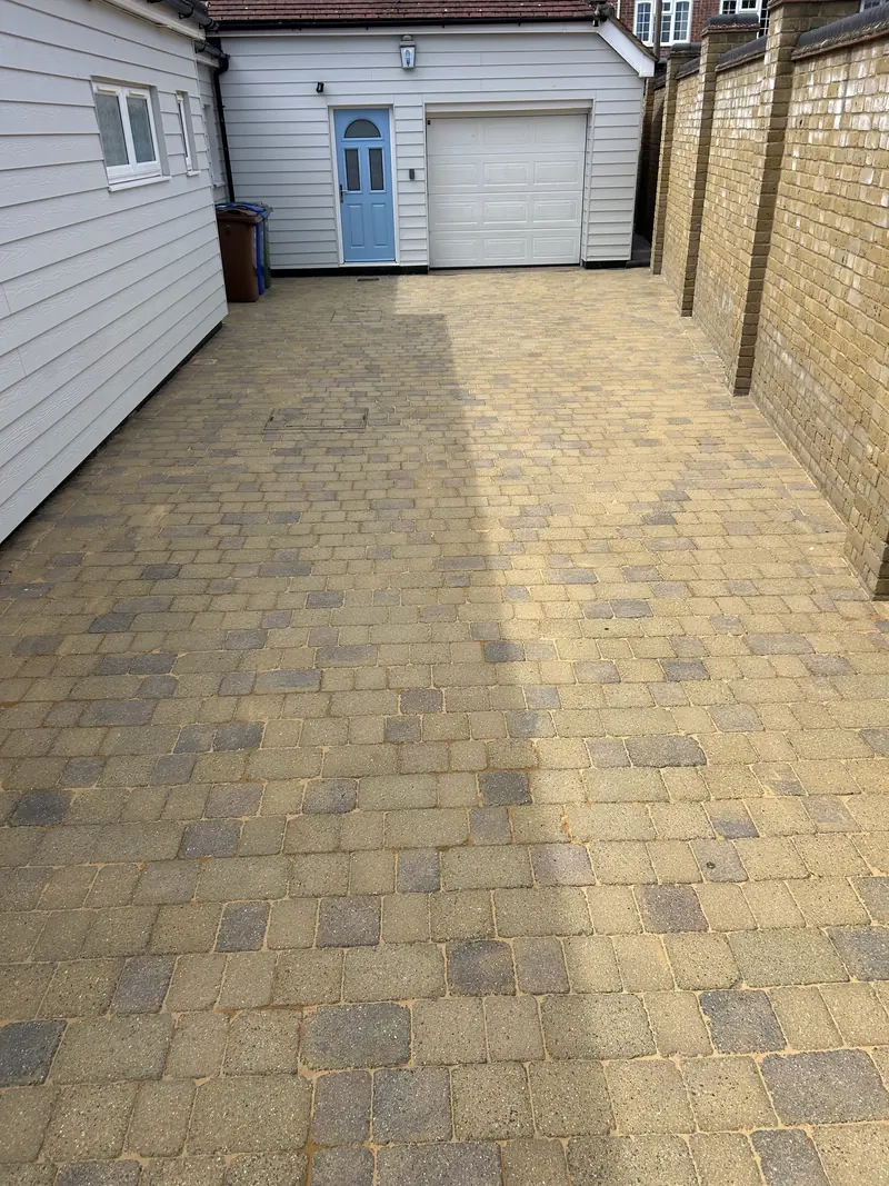 Buff block-paved passage to a garage after cleaning